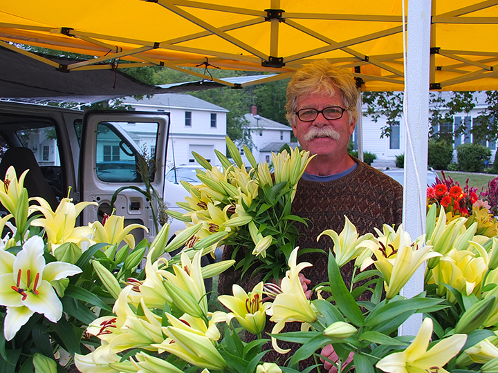 Jim Mercer of Sheepscot Flower Farm with his lillies. SUZI THAYER/Boothbay Register